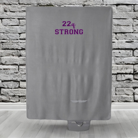 Gray roll up, travel blanket with green or purple "22q STRONG" design
